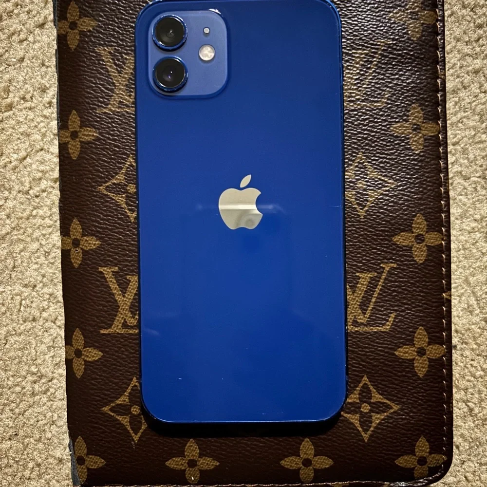 Blue Apple IPhone 12 must be unlocked by a Computer or for Parts.